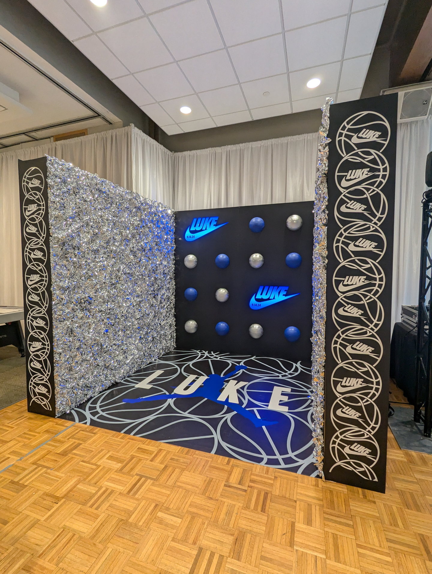 Black, blue and silver basketball-themed custom photo room with dimensional personalized branding