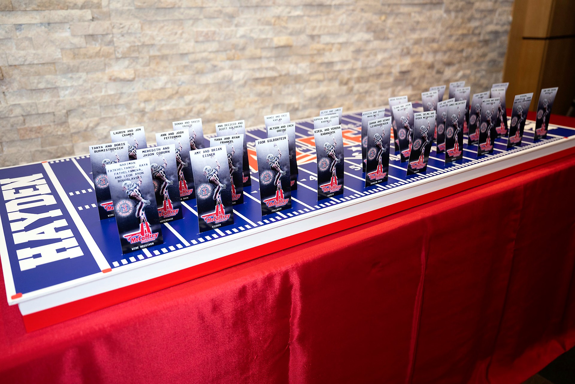 Custom football field seating display with personalized escort cards for a bar mitzvah