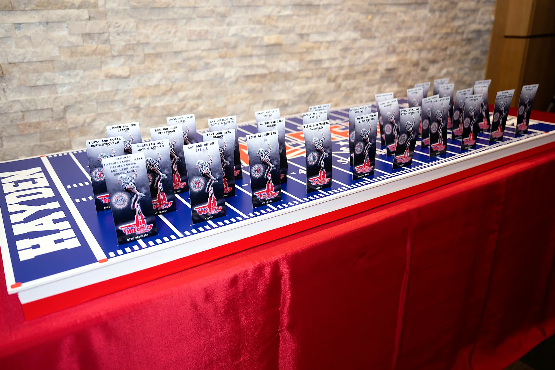 Custom football field seating display with personalized escort cards for a bar mitzvah